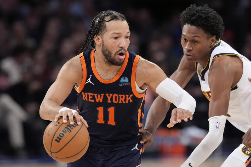 New York Knicks guard Jalen Brunson (11) drives against Denver Nuggets forward Peyton Watson, right, in the second half of an NBA basketball game, Thursday, Jan. 25, 2024, at Madison Square Garden in New York. (AP Photo/Mary Altaffer)