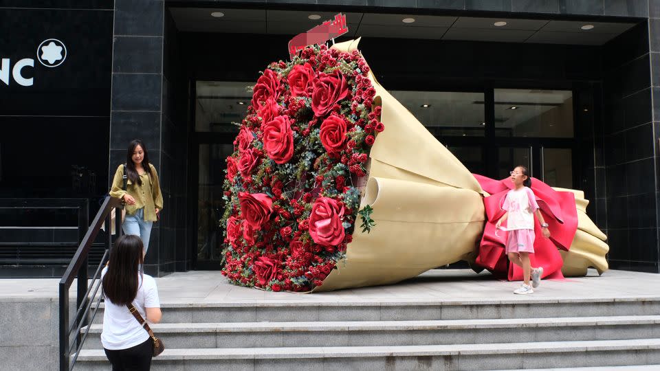 A red rose installation is on display at a commercial street ahead of Qixi Festival, or Chinese Valentine's Day, on August 20, 2023 in Shenyang, Liaoning province. - Huang Jinkun/VCG/Getty Images