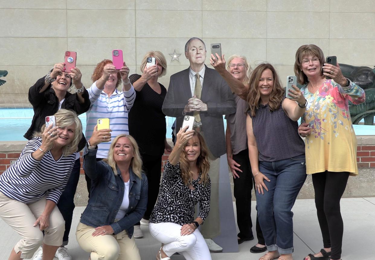 Port Huron Town Hall members posing for selfies with a cutout of John Lithgow. "Where's John Lithgow?" is a new contest the organization is holding where the winner will get two free tickets to its first presentation of its annual lecture series.