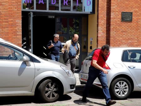 Officials who were conducting a tax probe at one of Google's Madrid offices leave the premises in Madrid, Spain, June 30, 2016. REUTERS/Andrea Comas