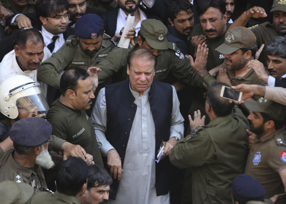 FILE - In this Friday, Oct. 11, 2019, file photo, Pakistani former Prime Minister Nawaz Sharif arrives at a court in Lahore, Pakistan. Sharif, who was convicted on corruption charges, has been rushed to hospital from the prison after recent blood tests raised doctors' concerns. (AP Photo/K.M. Chaudary,File)