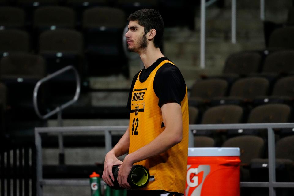 Northern Kentucky Norse center Noah Hupmann (42) warms up on the sideline at Truist Arena in Highland Heights, Ky., on Thursday, Oct. 27, 2022.