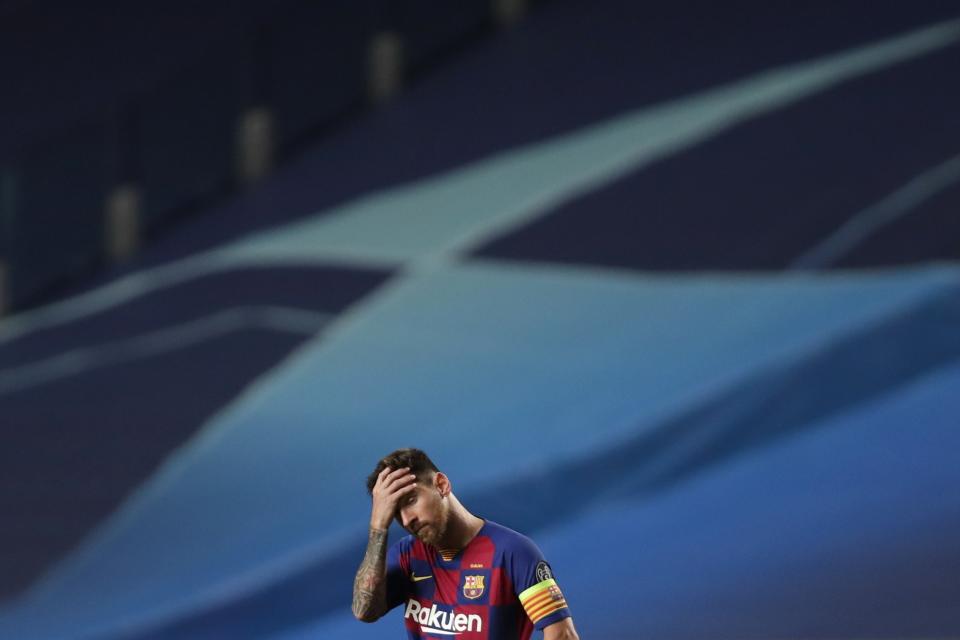 Barcelona's Lionel Messi reacts during the Champions League quarterfinal match between FC Barcelona and Bayern Munich at the Luz stadium in Lisbon, Portugal, Friday, Aug. 14, 2020. Gerard Piqué says Barcelona "hit rock bottom" in an 8-2 humiliation from Bayern Munich in the Champions League quarterfinals. It's 74 years since Barcelona conceded eight goals in a game. (AP Photo/Manu Fernandez/Pool)