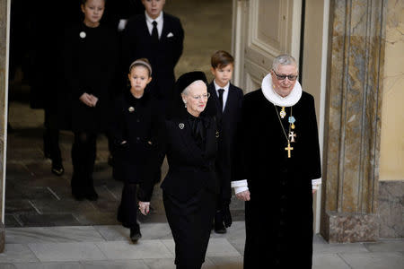 Queen Margrethe of Denmark is led into Christiansborg Castle Church by royal former confessor Erik Norman Svendsen at the funeral service of Prince Henrik in Christiansborg Castle Church at Copenhagen, Denmark February 20, 2018. Mads Claus Rasmussen/Ritzau Scanpix Denmark/via REUTERS