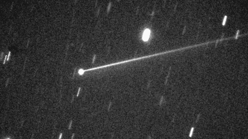 The Didymos-Dimorphos binary asteroid system after the DART impact, revealing an elongated debris plume. 