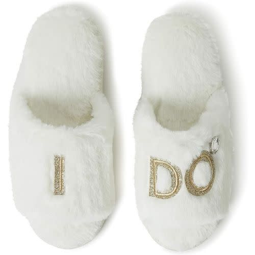 white fuzzy dearfoam slippers with gold embroidered "i do"