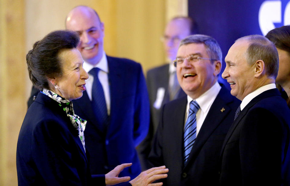 International Olympic Committee member Princess Anne of Great Britain, left, greets Russian President Vladimir Putin, right, IOC President Thomas Bach, second from right, and Sochi 2014 Olympics President Dmitry Chernyshenko, left, at an event welcoming IOC members ahead of the upcoming 2014 Winter Olympics at the Rus Hotel, Tuesday, Feb. 4, 2014, in Sochi, Russia. (AP Photo/David Goldman, Pool)