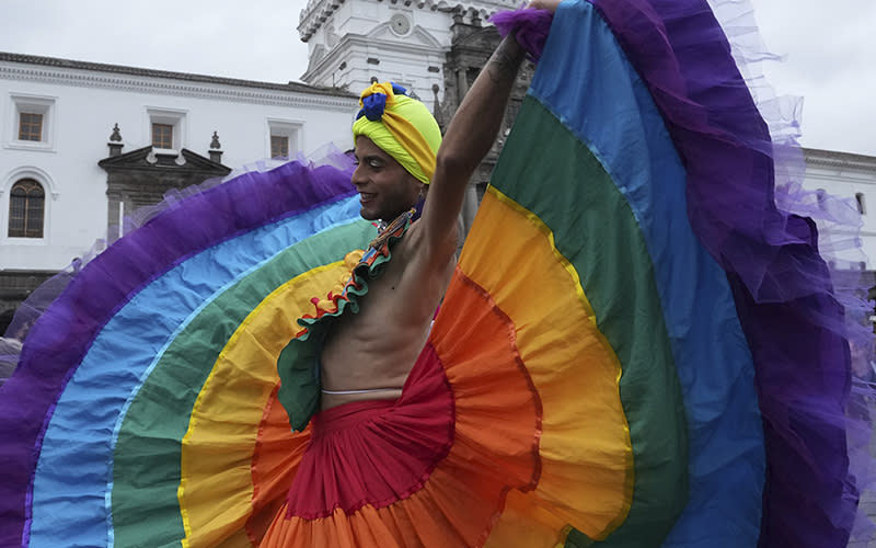 A LGBTQ+ dancer performs in the streets