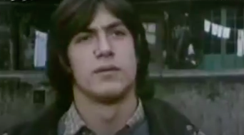 Still of Javier in "Segunda Enseñanza," he has shoulder-length hair