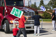 Retired GM union member Roxanne Williams, 63, stood-up to a semi-truck attempting to enter the GM Davison Road Processing Center. United Automobile Workers remain on strike against GM on Tuesday, Sept. 17, 2019 in Burton, Mich. Williams has worked for GM for 20 years. (Sara Faraj/The Flint Journal via AP)