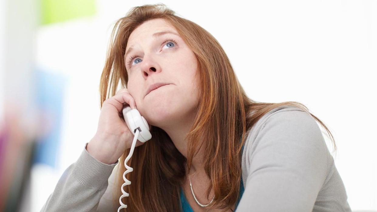 Frustrated woman on phone