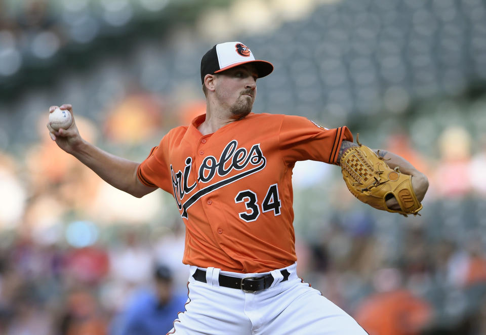 FILE - In this July 28, 2018 file photo Baltimore Orioles starting pitcher Kevin Gausman delivers during the first inning of a baseball game against the Tampa Bay Rays in Baltimore. Atlanta Braves manager Brian Snitker says the Braves ‘hit all the boxes’ with four trade-deadline deals. Atlanta acquired Gausman and Darren O’Day from Baltimore in their last trade, Tuesday, July 31 , 2018. Gausman joins Atlanta’s rotation as the Braves chase a playoff spot. (AP Photo/Nick Wass, file)