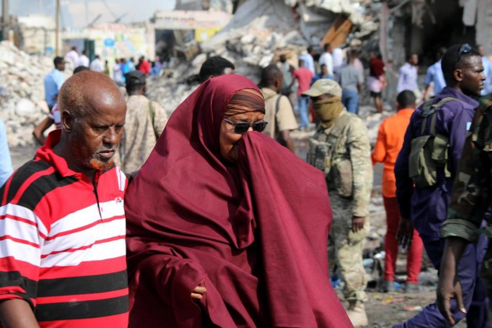 Bombing: Somali woman mourns at the scene of the explosion (REUTERS)