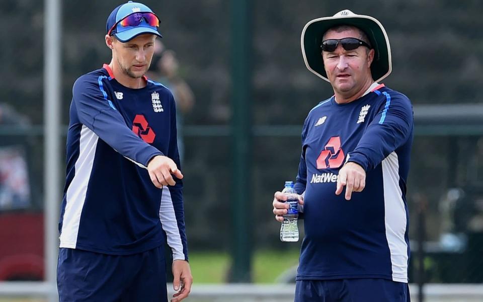 Joe Root and assistant coach Paul Farbrace inspect the pitch - AFP