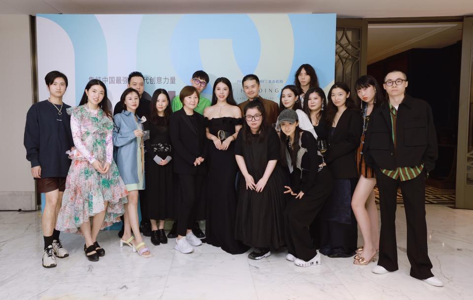 Wendy Yu (center), Madame Lv, vice secretary general of Shanghai Fashion Week and designers. - Credit: Courtesy