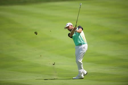 Aug 2, 2015; Gainesville, VA, USA; Troy Merritt hits his second shot from the fairway on the 2nd hole in the final round of the Quicken Loans National golf tournament at Robert Trent Jones Golf Club. Mandatory Credit: Rafael Suanes-USA TODAY Sports