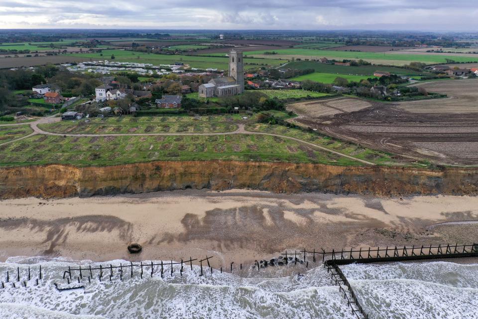 A general view of erosion to the cliff face and the scarred landscape of a former caravan site in the village of Happisburgh on November 06, 2019 in Great Yarmouth, England.