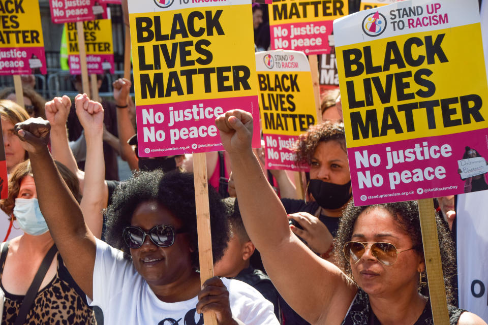  Demonstrators gesture while holding Black Lives Matter placards during the anti-racism protest.
Demonstrators held speeches and took the knee outside Downing Street in solidarity with England football players; Marcus Rashford, Bukayo Saka and Jadon Sancho, following the online racist abuse the trio received after the Euro 2020 final between England and Italy. (Photo by Vuk Valcic / SOPA Images/Sipa USA) 