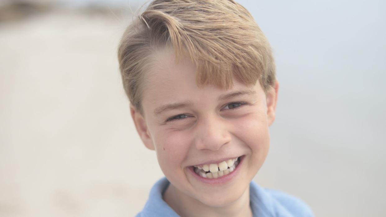 Prince George is pictured smiling for the camera on a UK beach in a photograph released to mark his ninth birthday. (The Prince and Princess of Wales/PA)

