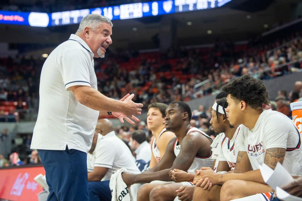 Auburn Tigers head coach Bruce Pearl talks with his team on the bench as Auburn Tigers take on Pennsylvania Quakers at Neville Arena in Auburn, Ala., on Tuesday, Jan. 2, 2024. Auburn Tigers lead Penn Quakers 51-32 at halftime.
