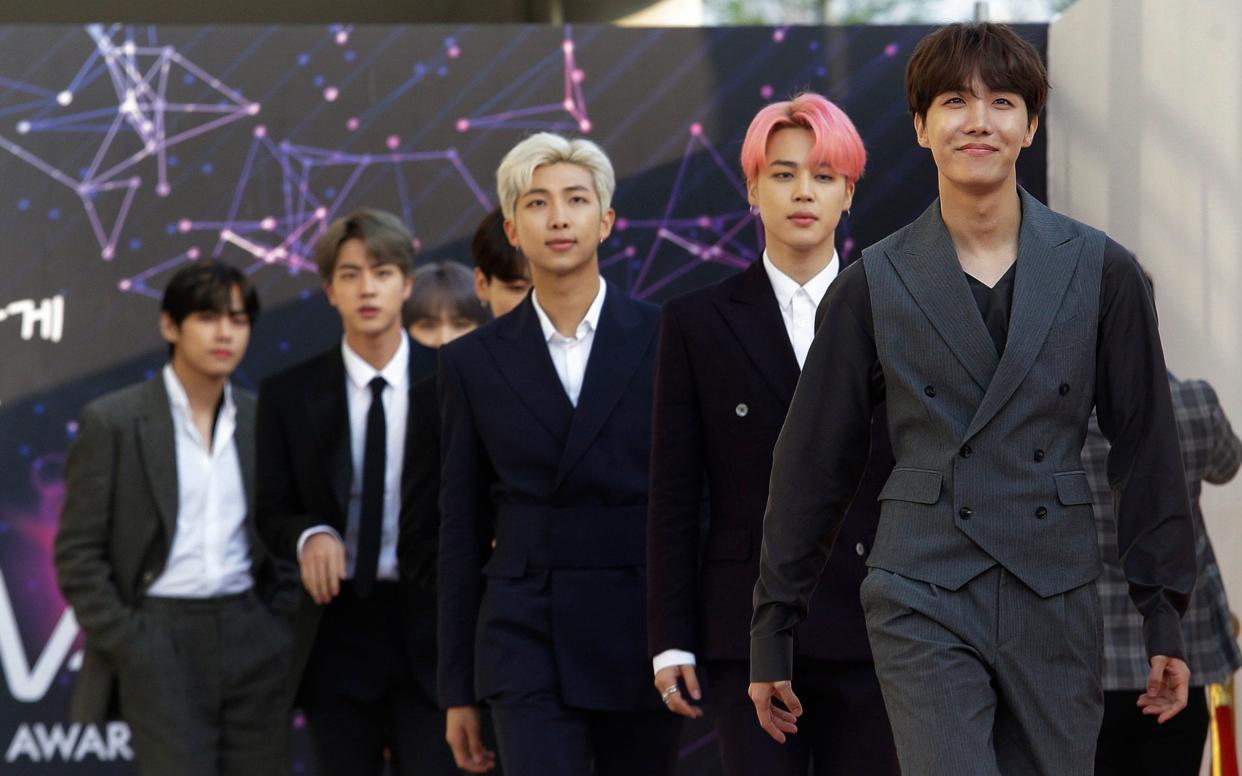 Members of South Korean K-Pop group BTS arrive to attend The Fact Music Awards in Incheon, South Korea - AP