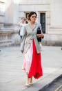 A guest is seen wearing red pink two tone skirt outside Victoria Beckham. [Photo: Getty Images]