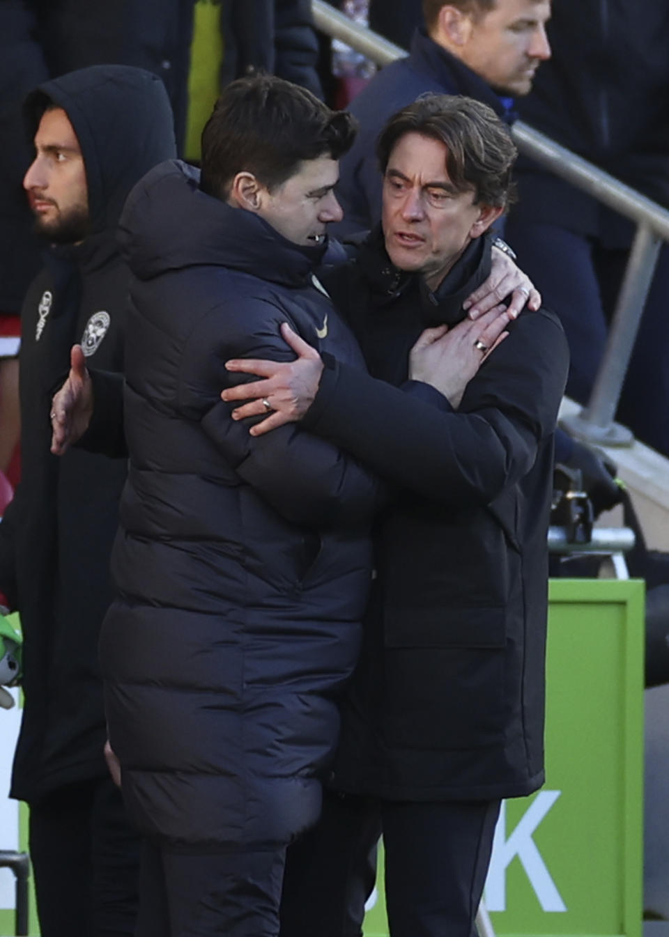 Chelsea's head coach Mauricio Pochettino, left and Brentford's head coach Thomas Frank hug at the end of an English Premier League soccer match between Brentford and Chelsea at the Gtech Community Stadium in London , Saturday, March 2, 2024. (AP Photo/Ian Walton)