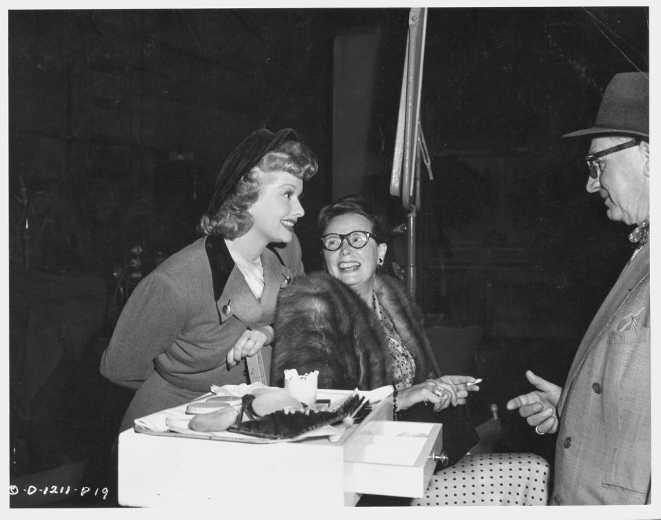 <p>Director Lloyd Bacon chats with his leading actress and her mother, Desiree Hunt, on the set of <a href="https://www.amazon.com/Fuller-Brush-Girl-Lucille-Ball/dp/B003Q5N6T8/?tag=syn-yahoo-20&ascsubtag=%5Bartid%7C10055.g.33332561%5Bsrc%7Cyahoo-us" rel="nofollow noopener" target="_blank" data-ylk="slk:The Fuller Brush Girl;elm:context_link;itc:0;sec:content-canvas" class="link "><em>The Fuller Brush </em><em>Girl</em></a><em>. </em>The actress's mother was always supportive of her career and enrolled her in <a href="https://www.biography.com/actor/lucille-ball" rel="nofollow noopener" target="_blank" data-ylk="slk:drama school in New York City;elm:context_link;itc:0;sec:content-canvas" class="link ">drama school in New York City</a> at the age of 15.</p>