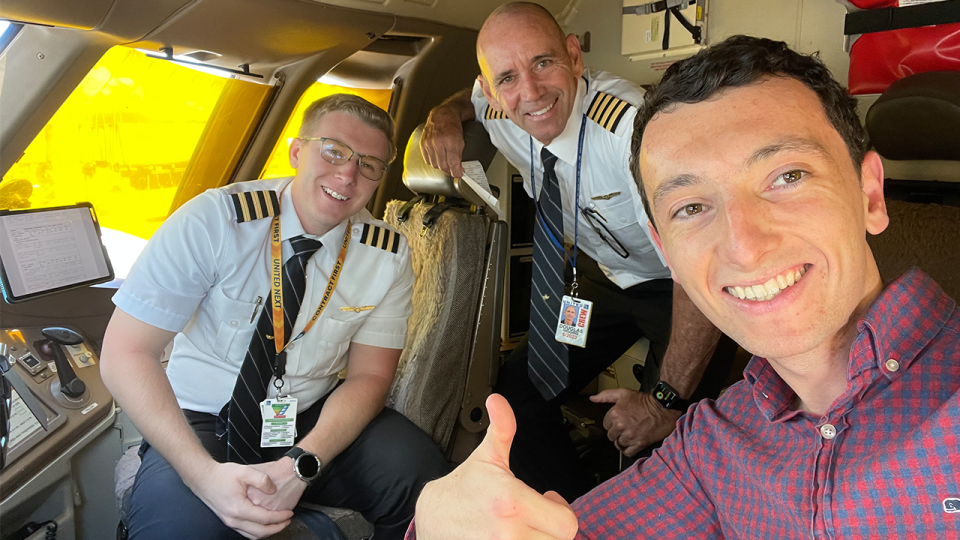 Travel products editor Kyle Olsen in the cockpit of a Boeing 777-300ER with two Denver-based United pilots - Kyle Olsen/CNN Underscored