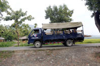 FILE PHOTO: A police truck passes by a Rohingya village outside Maungdaw October 26, 2016. Picture taken October 26, 2016. REUTERS/Soe Zeya Tun//File Photo