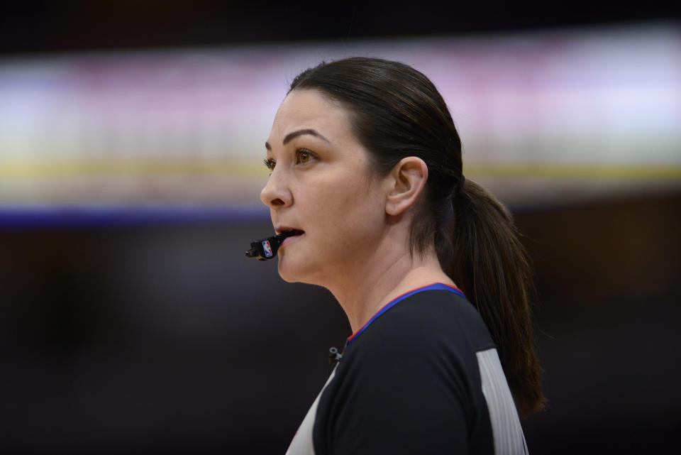 Referee Lauren Holtkamp-Sterling watches during the first half of an NBA basketball game between the Chicago Bulls and the Golden State Warriors on Friday, Dec. 6, 2019, in Chicago. This is Holtkamp-Sterling's first game back since giving birth. (AP Photo/Paul Beaty)