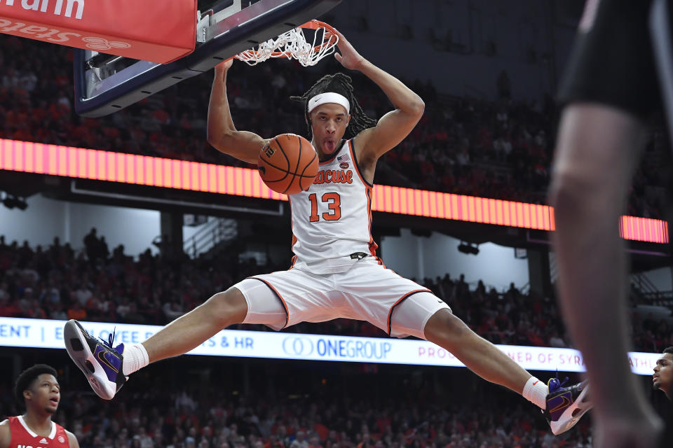 Syracuse forward Benny Williams dunks against North Carolina State during the second half of an NCAA college basketball game in Syracuse, N.Y., Saturday, Jan. 27, 2024. (AP Photo/Adrian Kraus)