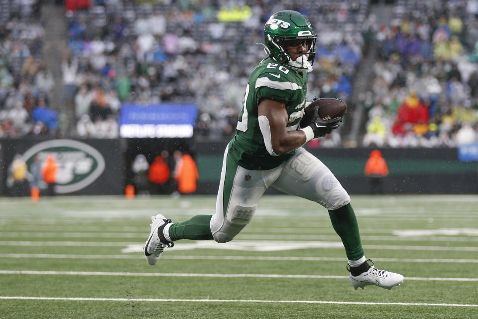 New York Jets running back Breece Hall (20) carries the ball for a touchdown against the Houston Texans during the fourth quarter of an NFL football game, Sunday, Dec. 10, 2023, in East Rutherford, N.J. (AP Photo/John Munson)