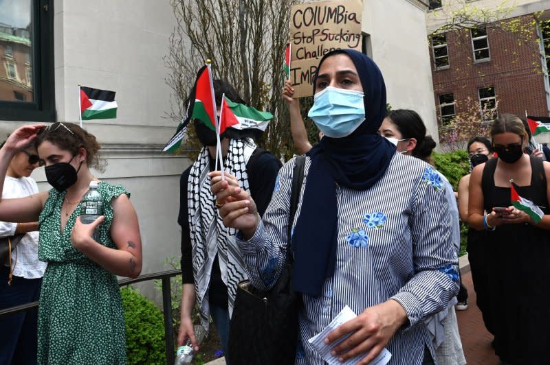 Pro-Palestine protestors march through the grounds of Columbia University in New York City on Monday. The University announced that classes would be held remotely starting Monday, as pro-Palestinian protests have continued for almost 2 weeks on the school's campus. Photo by Louis Lanzano/UPI