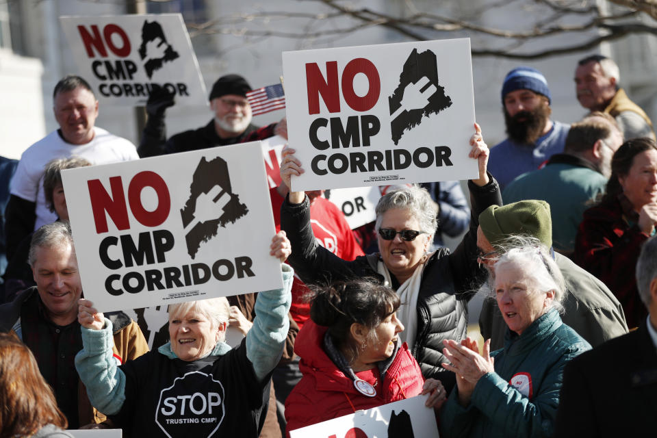 FILE-Supporters of "No CMP Corridor" attend a rally after submitting more than 75,000 signatures to election officials at the State Office Building, Feb. 3, 2020, in Augusta, Maine. If voters grant their approval on Tuesday, Nov. 7, 2023, Maine would be the 10th state to close the loophole in federal election law that bans foreign entities from spending on candidate elections, yet allows donations for local and state ballot measures. (AP Photo/Robert F. Bukaty, files)