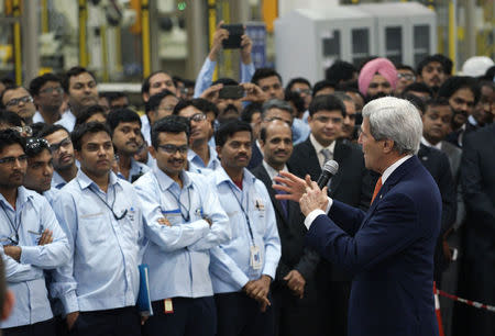 U.S. Secretary of State John Kerry talks to workers at a soon-to-be-opened Ford India automotive factory in Sanand January 12, 2015. REUTERS/Rick Wilking