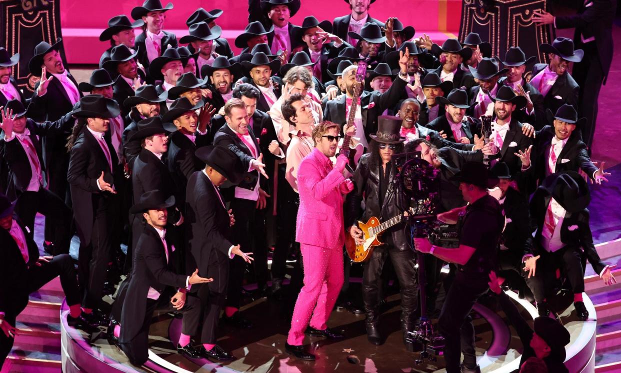<span>Ryan Gosling, guitarist Slash and 65 Kens perform I'm Just Ken from the film Barbie during the Oscars show.</span><span>Photograph: Mike Blake/Reuters</span>