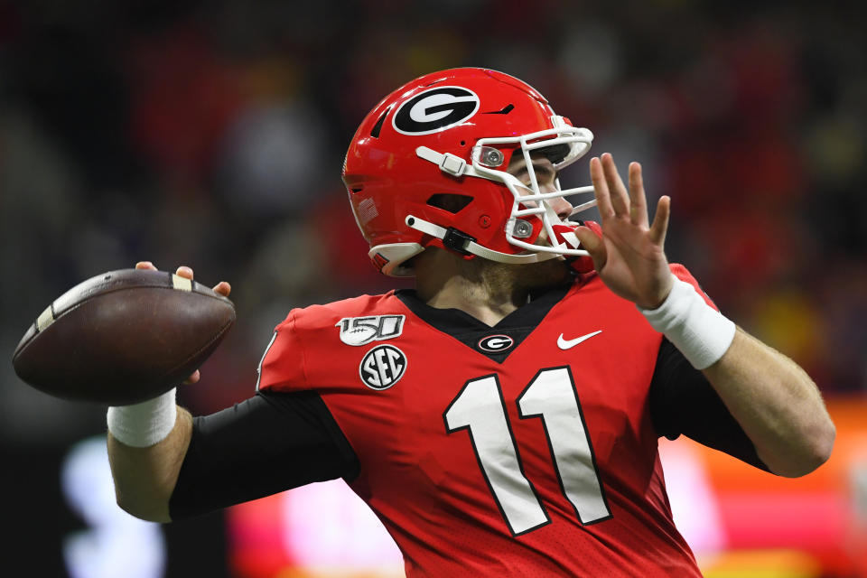 Georgia quarterback Jake Fromm (11) works against LSU during the first half of the Southeastern Conference championship NCAA college football game, Saturday, Dec. 7, 2019, in Atlanta. (AP Photo/John Amis)