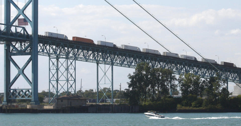 Commercial trucks line up on the Ambassador bridge crossing over to Detroit, Michigan from Windsor, Ontario