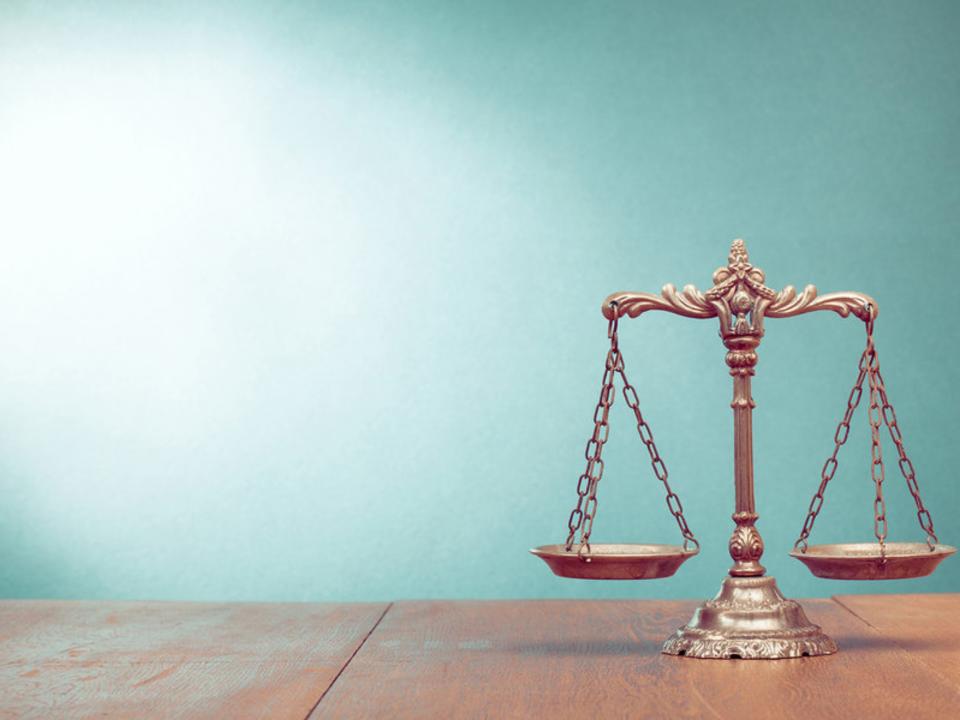 Close-Up Of Weight Scale On Wooden Table Against Turquoise Wall