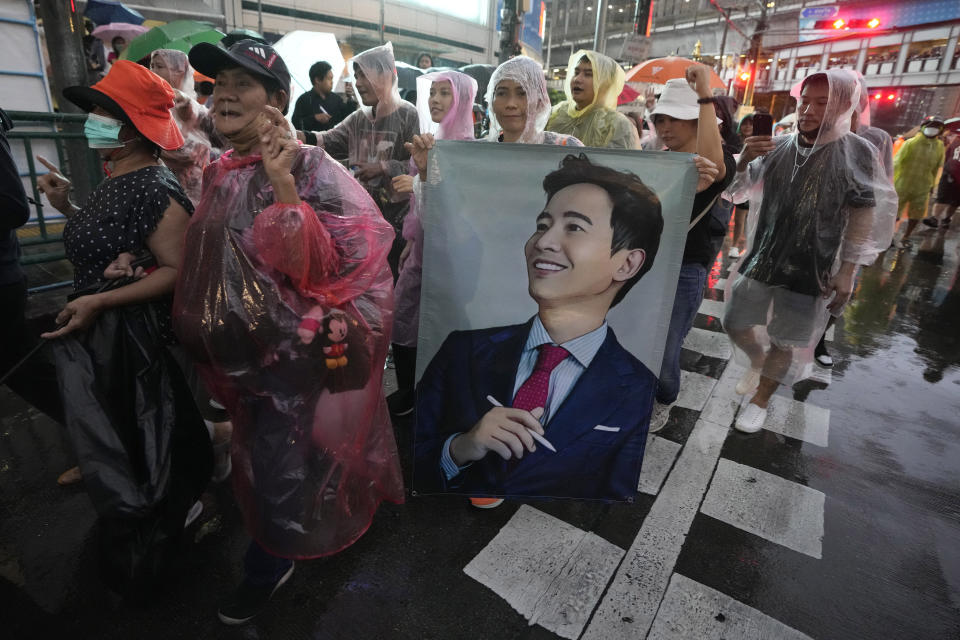Supporters of the Move Forward Party hold a portrait of Pita Limjaroenrat, the leader of Move Forward Party, during a protest in Bangkok, Thailand, Sunday, July 23, 2023. The demonstrators are protesting that Thailand's Constitution is undemocratic, because it allowed Parliament to block the winner of May's general election, the Move Forward Party, from naming its leader named the new prime minister, even though he had assembled an eight-part coalition that had won a clear majority of seats in the House of Representatives. (AP Photo/Sakchai Lalit) holds portrait of Pita Limjaroenrat, the leader of Move Forward Party