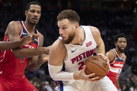 Dec 26, 2018; Detroit, MI, USA; Detroit Pistons forward Blake Griffin (23) gets defended by Washington Wizards forward Trevor Ariza (1) during the fourth quarter at Little Caesars Arena. Mandatory Credit: Raj Mehta-USA TODAY Sports