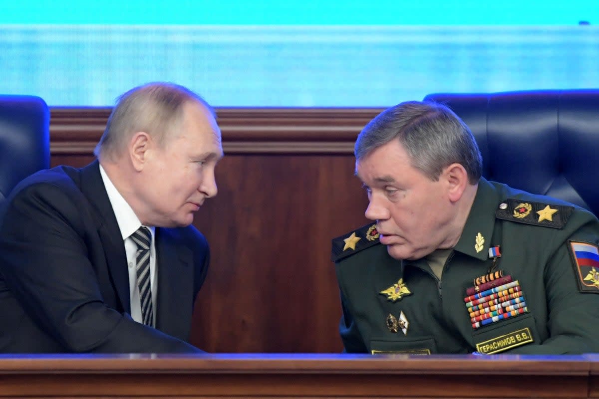 Vladimir Putin alongside  Russian military chief  General Valery Gerasimov  (SPUTNIK/AFP via Getty Images)