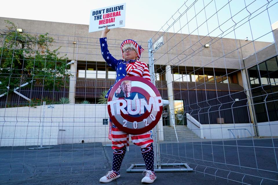 Trump supporter Tara Immen of Happy Valley, Ariz., protests at the Maricopa County Elections Department in Phoenix on Nov. 18, 2020.