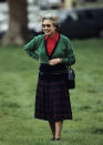 Taking part in some equestrian spectating at the Windsor Horse Show in 1991, Her Majesty paired a modest tartan skirt with a red blouse and green cardigan to create the perfect balance of countryside chic.