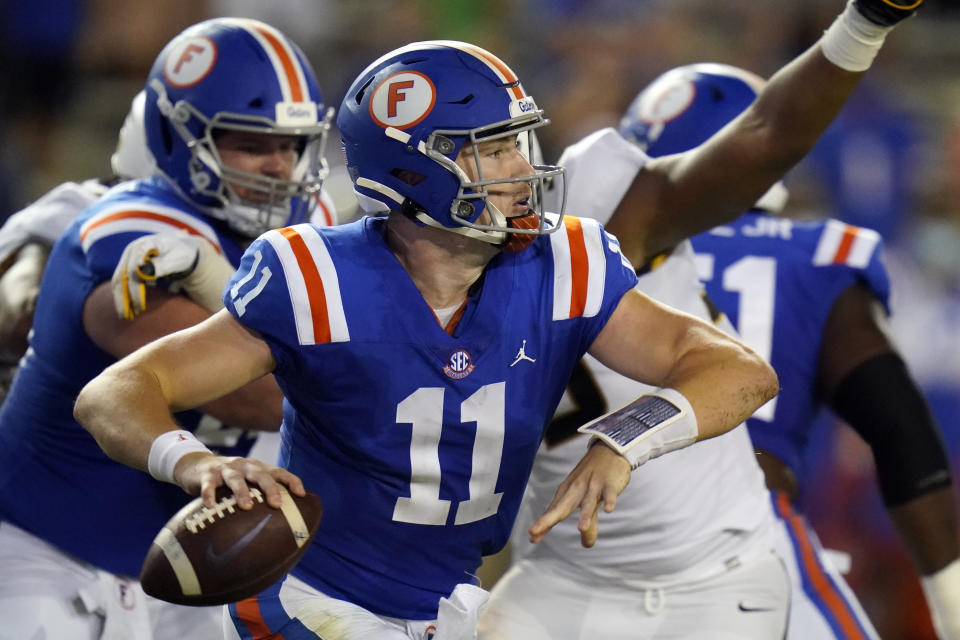 Florida quarterback Kyle Trask (11) looks for a receiver during the first half of an NCAA college football game against Missouri, Saturday, Oct. 31, 2020, in Gainesville, Fla. (AP Photo/John Raoux)