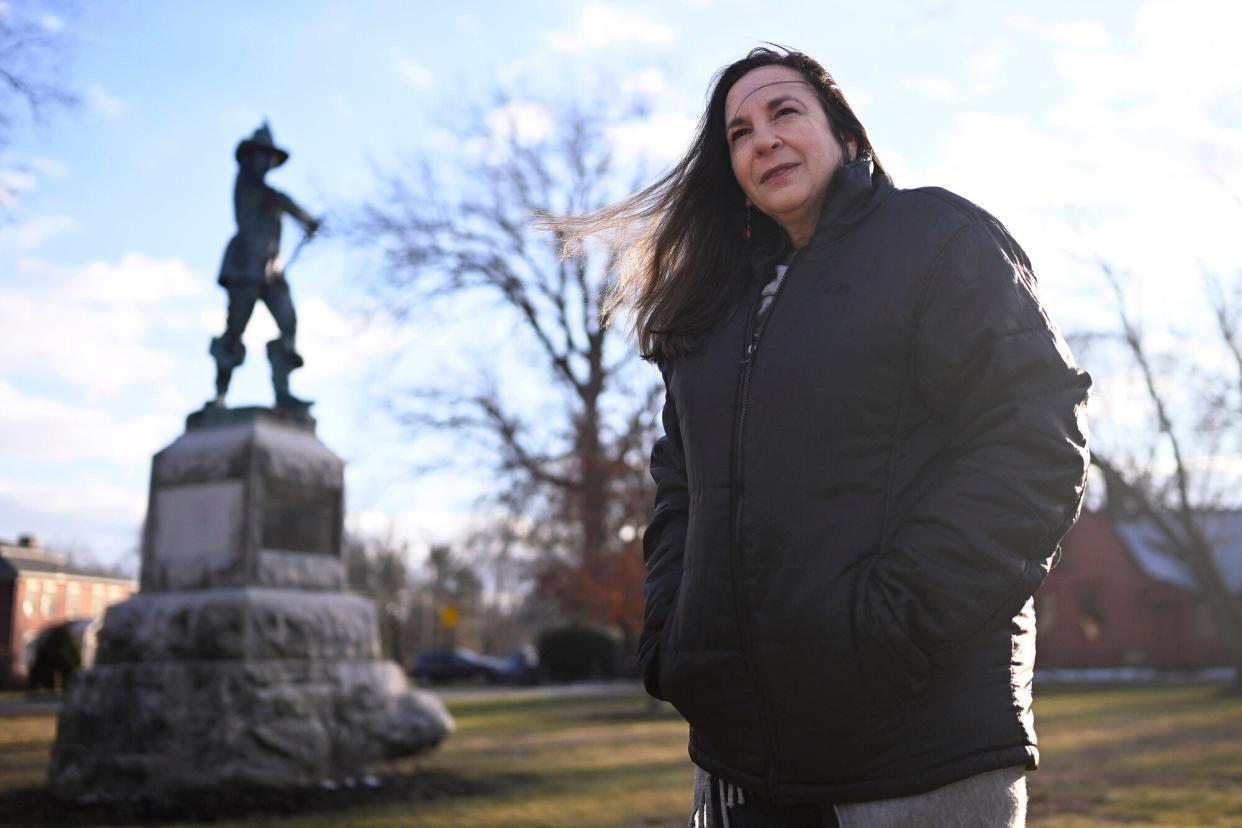 In this Tuesday, Jan. 24, 2023 photo, Beth Caruso, author and co-founder of the CT Witch Trial Exoneration Project, which was created to clear the names of the accused, stands on the Palisado Green in Windsor, Conn., where in 1651, an accident during a local militiamen training exercise led to the accusation of witchcraft and hanging of Lydia Gilbert. Now, more than 375 years later, amateur historians, researchers and descendants of the accused witches and their accusers, from across the U.S., are urging Connecticut officials to officially acknowledge this dark period of the state's colonial history and posthumously exonerate those wrongfully accused and punished.