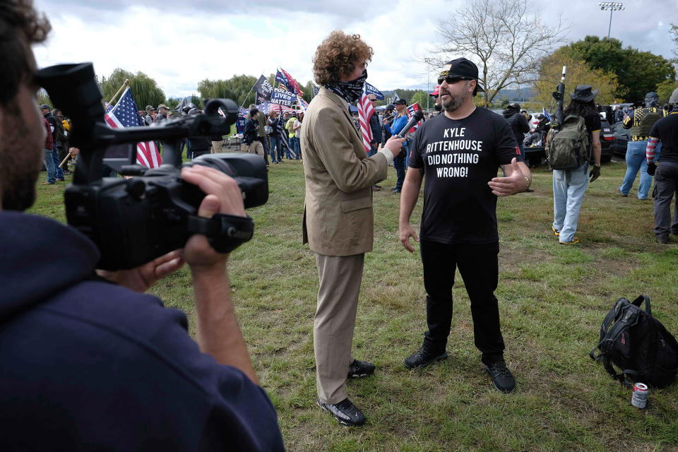 Andrew Callaghan of "All Gas No Brakes" interviews a Proud Boy as they gather in Portland, Ore., at Delta Park on September 26, 2020, in support of Kenosha shooter Kyle Rittenhouse and Aaron 'Jay' Danielson who was shot dead by an antifascist protester during the ongoing Black Lives Matter protests in the city. (Photo by Alex Milan Tracy/Sipa USA)(Sipa via AP Images)
