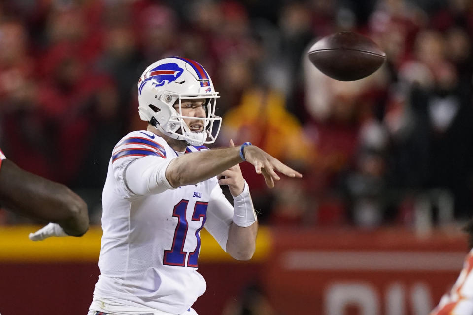 Buffalo Bills quarterback Josh Allen (17) throws a pass during the first half of an NFL divisional round playoff football game against the Kansas City Chiefs, Sunday, Jan. 23, 2022, in Kansas City, Mo. (AP Photo/Charlie Riedel)