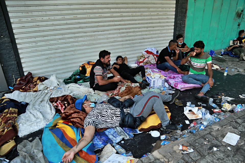 Anti-government protesters rest during sit-in at Tahrir Square in Baghdad, Iraq, Saturday, Oct. 26, 2019. The latest eruption of anti-government anger followed a nearly three-week hiatus to leaderless, spontaneous revolts which were violently quelled earlier this month in the war-torn country.(AP Photo/Hadi Mizban)